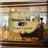 D65. Haagen Dazs mirrored sign.